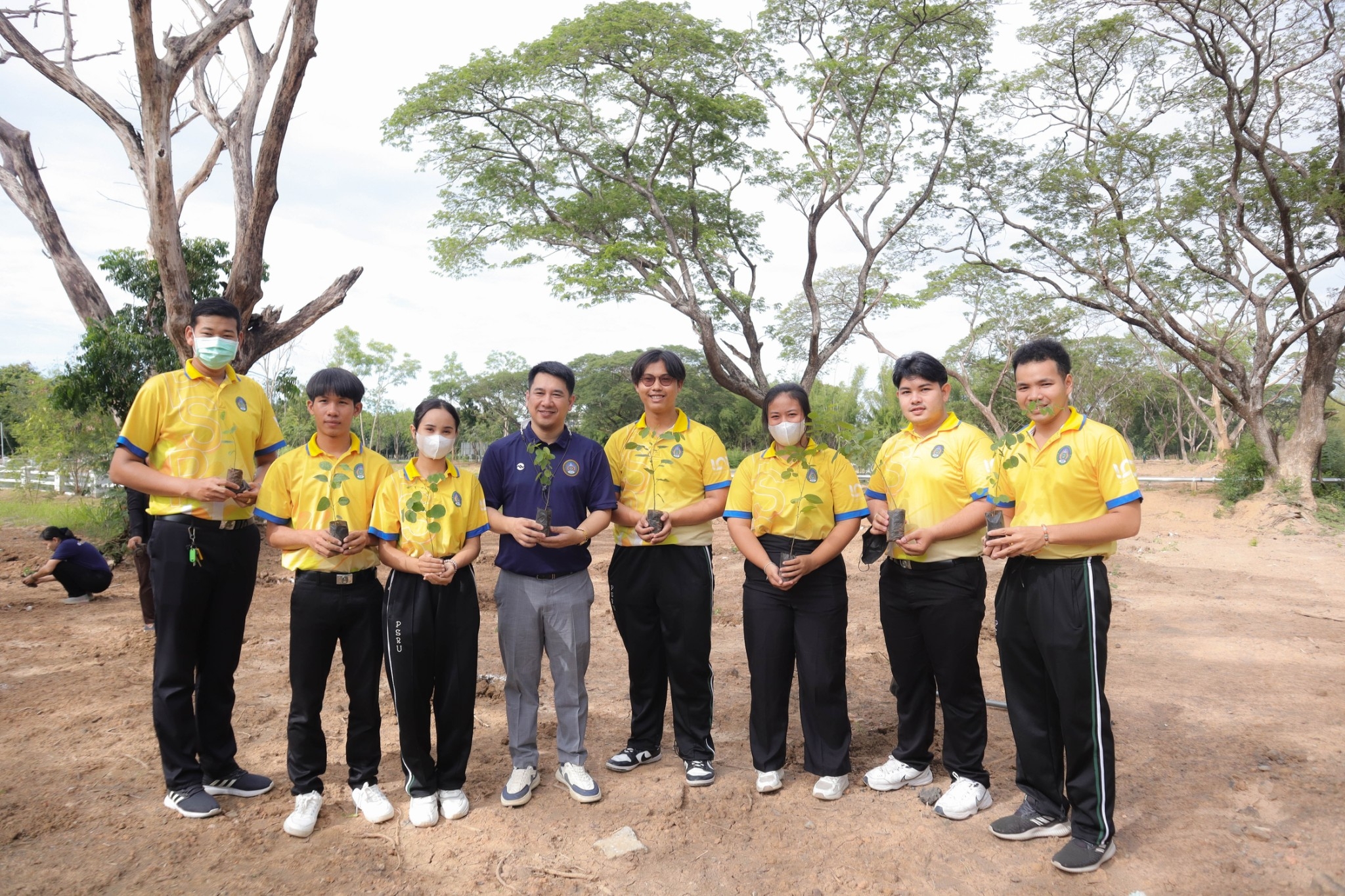 Student Development Division Planting Tree on Campus